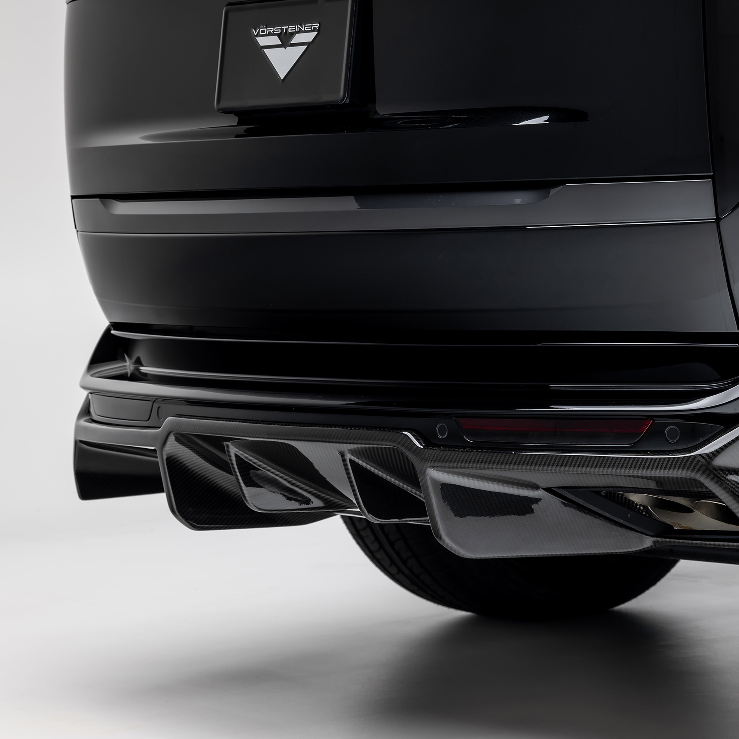 L460 diffuser fins under rear bumper, rear 3/4 close-up