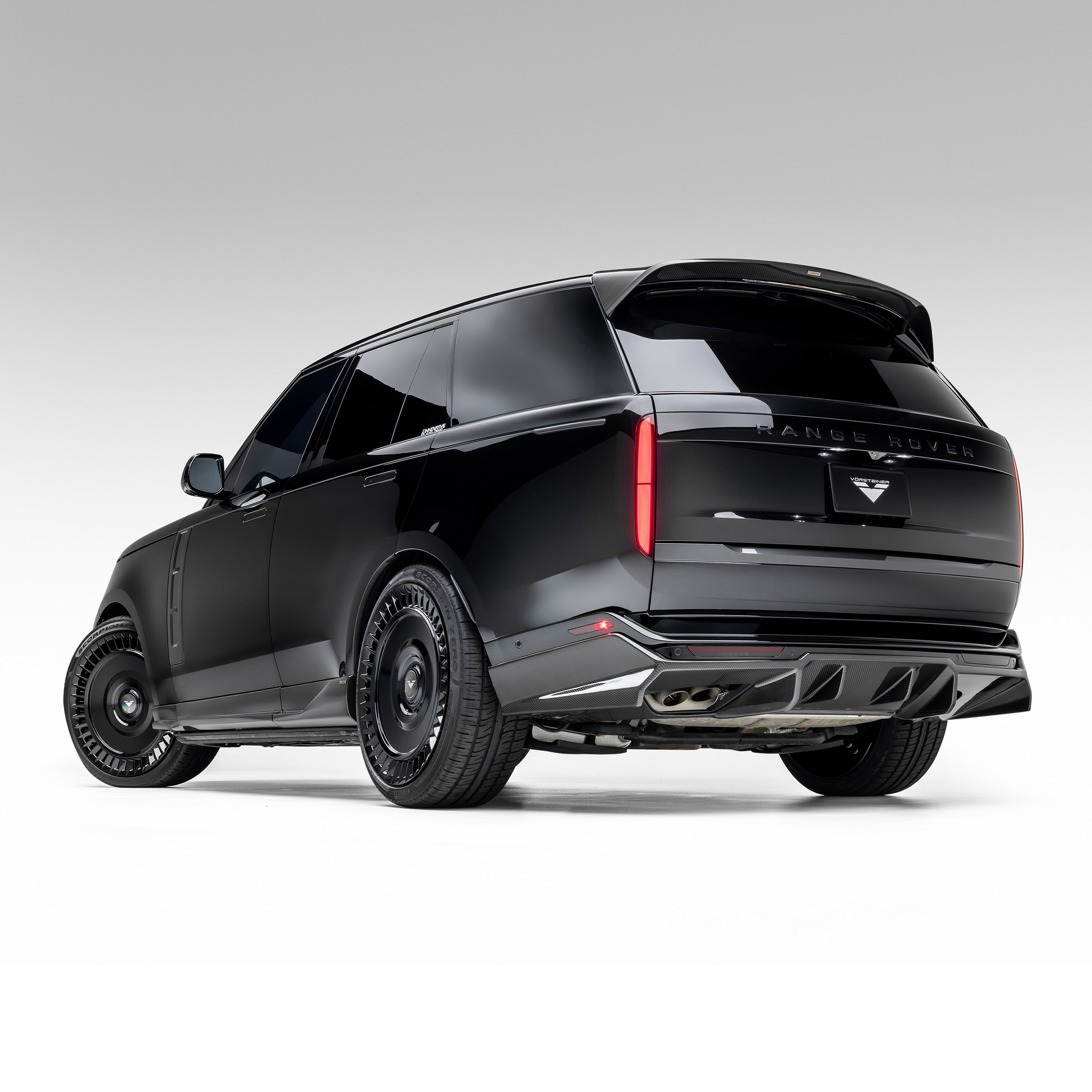 Black Range Rover L460 with carbon diffuser, rear 3/4 of SUV