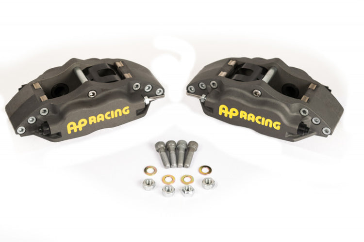 A front view of the AP Racing Competition Caliper Kit BMW e46 M3 Four Piston Rear (Caliper Only) with a white background