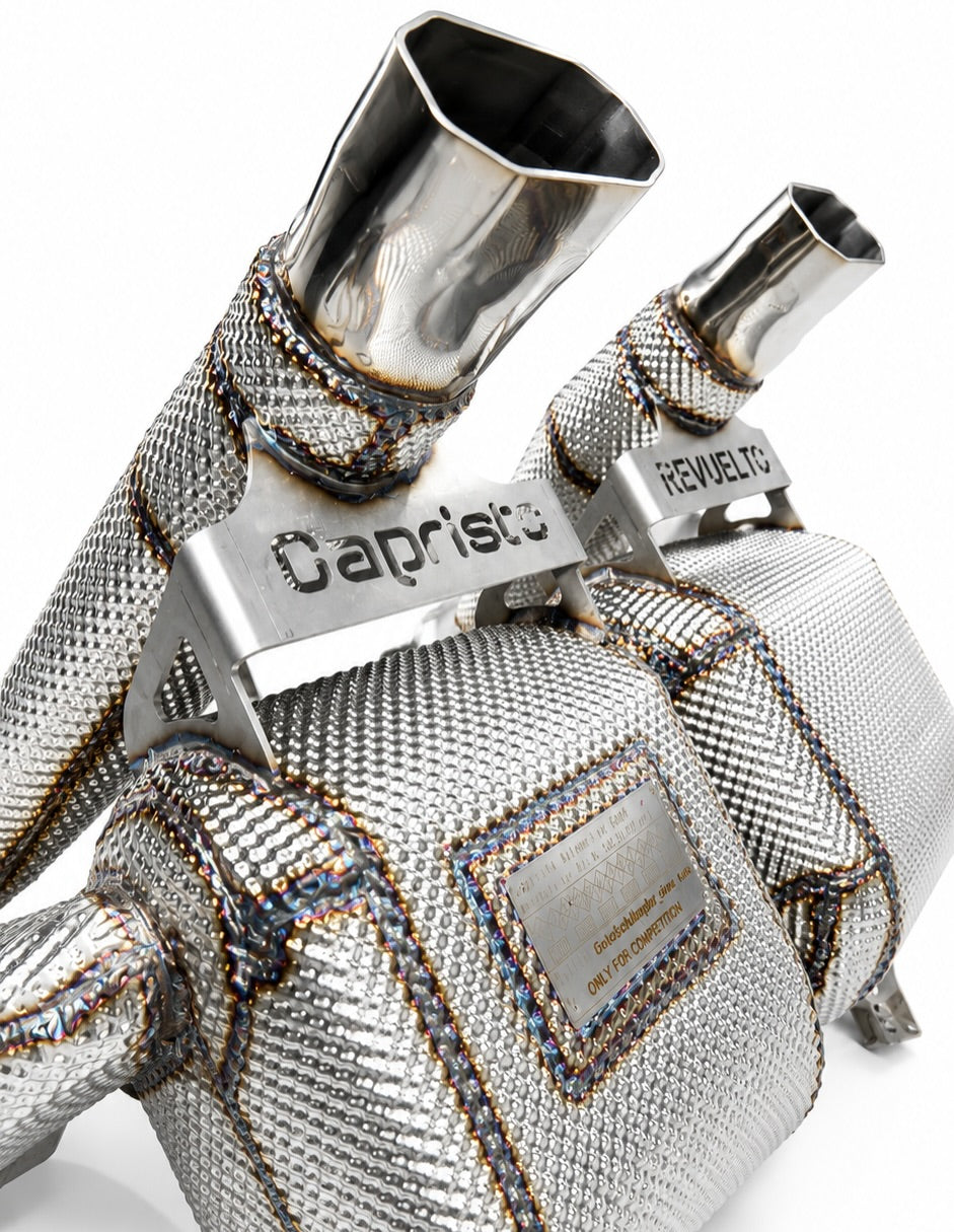 Close-up of hexagonal stainless tip and Capristo logo bracket on the Revuelto exhaust