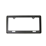 APR Performance Carbon Fiber License Plate Frame with white background