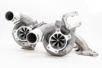 A front view of Pure Turbos BMW S58 STG2+ Upgrade Turbos with a white background