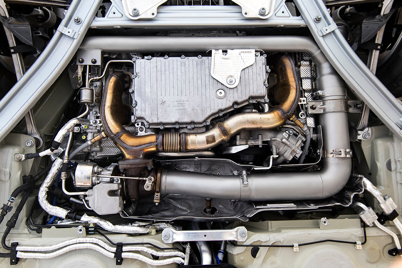Soul 718 Boxster / Cayman catted / catless downpipes: downpipe fitted in the engine bay from below