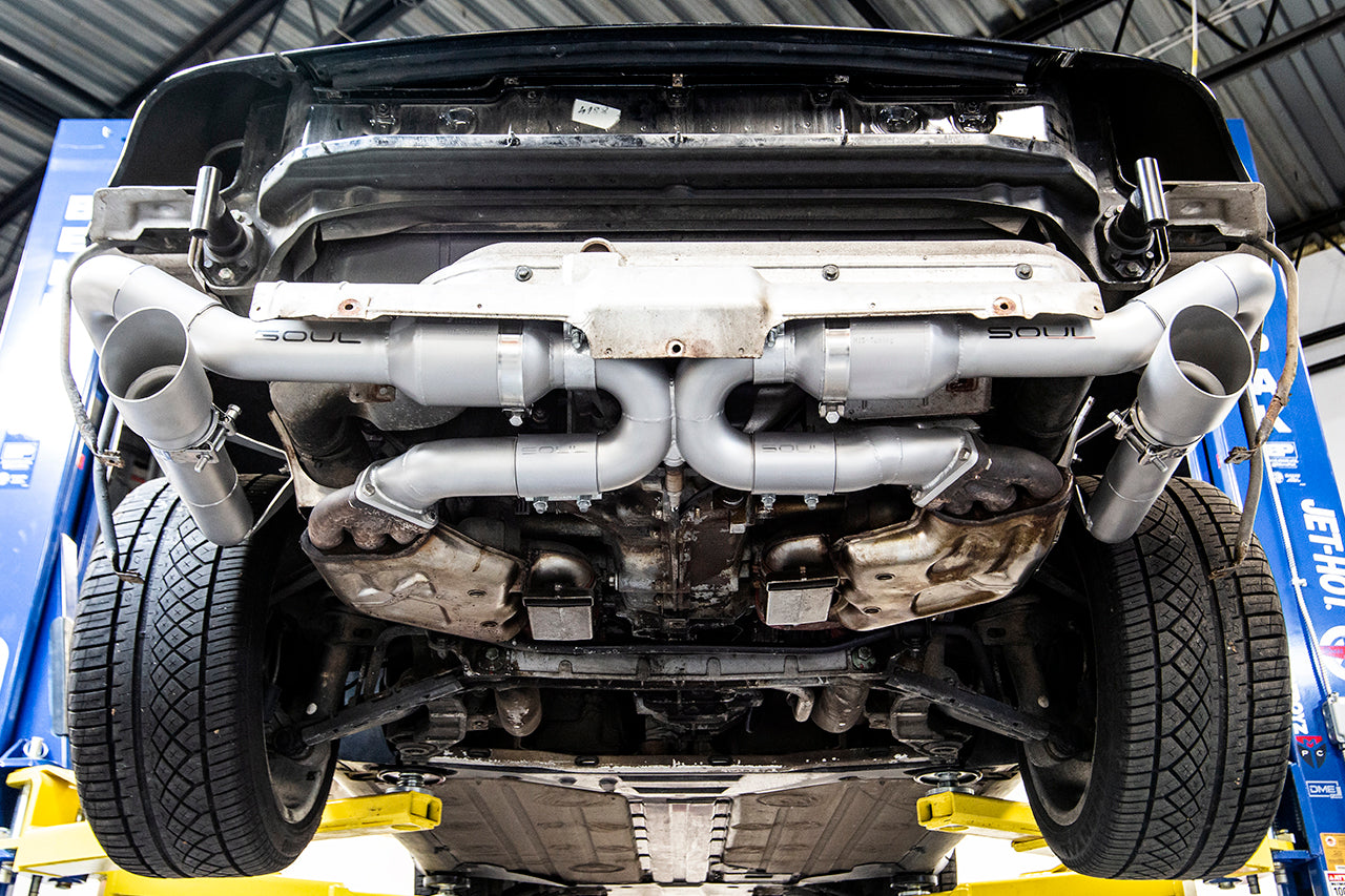 Soul 993 Carrera sport cat muffler bypass exhaust: exhaust installed under a 993 on a lift