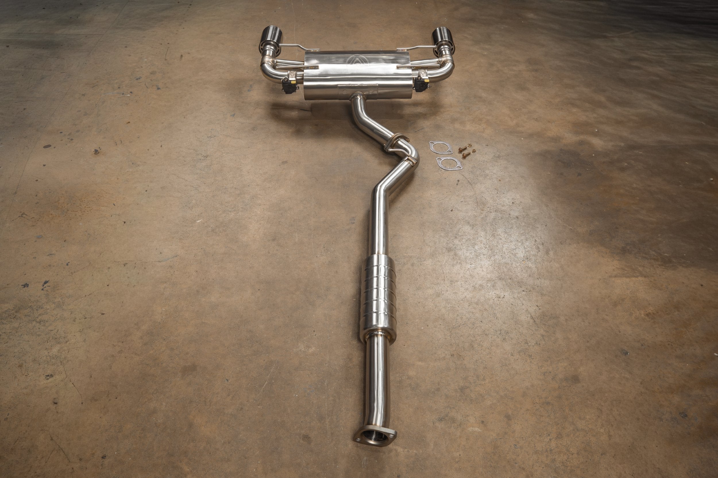 Full-length SHUTO exhaust viewed from the inlet toward the rear muffler