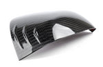 A close up view of Dinan Mirror Cover Set for Toyota GR Supra 2020-2025 with white background