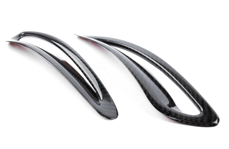 A top view of Dinan Side Hood Vent Covers for Toyota GR Supra 2020-2025 with white background