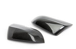 A top view of Dinan Mirror Cap Set for BMW with white background