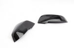 A top view of Dinan Mirror Cap Set for BMW with white background