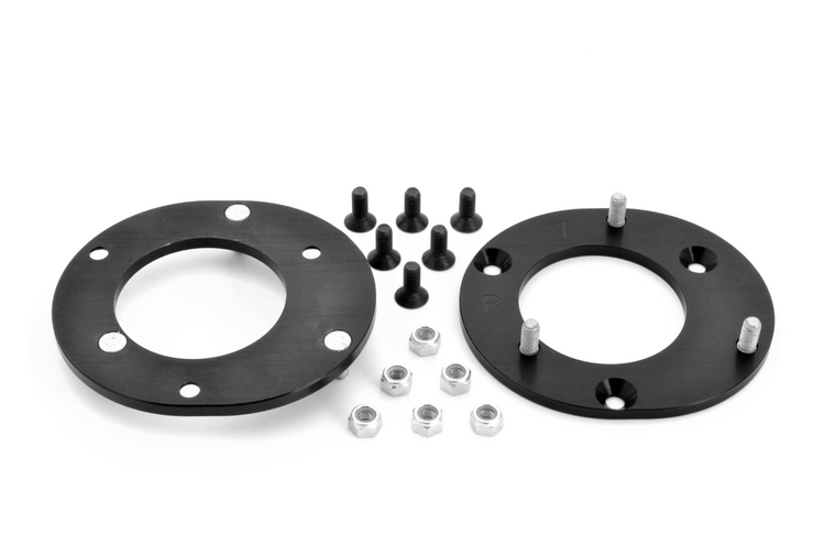 A top view of Dinan Camber Plates for BMW 128i / 135i / 325i / 328i / 330i / 335i / 335is 2006-2013 with all its parts on a white background