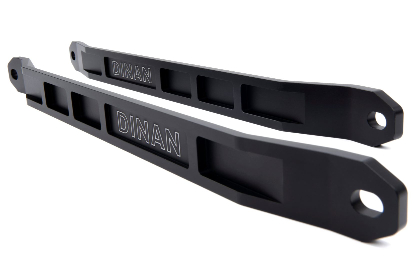 A side wide view of two of Dinan Strut Tower Braces for BMW with white background