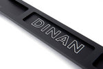 A top close up view of A top view of Dinan Strut Tower Braces for BMW with white background with the dinan logo on the brace