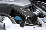 A close up view of Dinan Semi-Open Intake for BMW M240i / 340i / 440i 2016-2021 fitted in a car with white background