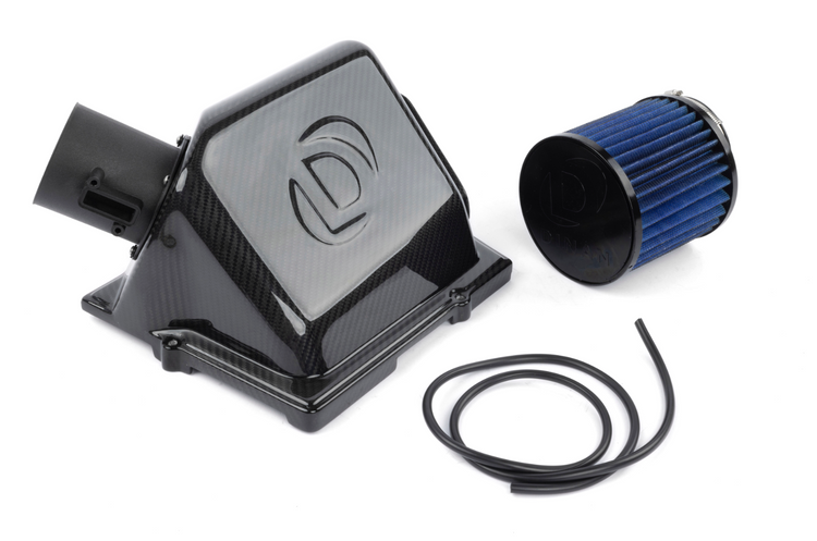 A top view of Dinan High Flow Intake System for BMW and Mini with all its parts on a white background