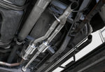 A view of a lifted car from underneath fitted with Stillen Off-Road Series Exhaust for Toyota Tundra 2007-2013