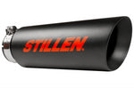 A close up view of the black tip of the Stillen Cat-Back Exhaust System w/ Black Tip for Nissan Titan [5.6L] (NON-XD) 2WD/4WD 2016-2024 with the Stillen logo on it in red on a white background