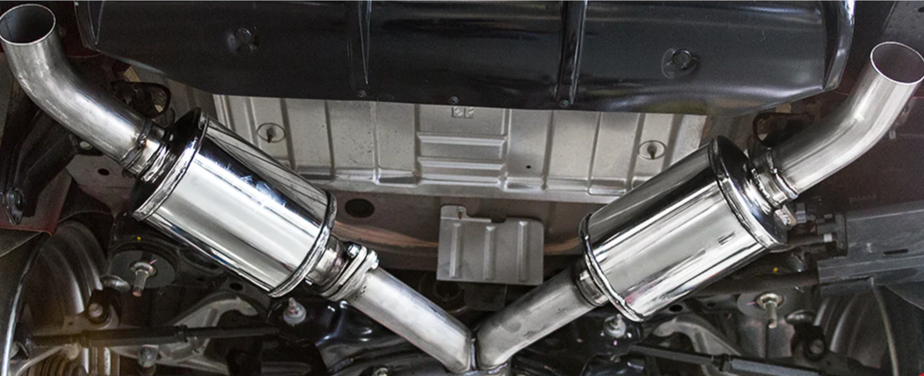 A close up view of Stillen Cat-Back Exhaust System w/ (Polished / Burnt / Carbon Tips) for Infiniti Q60 3.0t 2017-2022 fitted in a car from inside