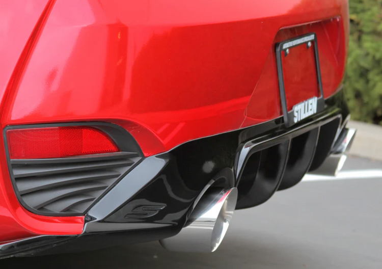 A view of the polished tips fitted on the back of a red car of the Stillen Cat-Back Exhaust System w/ (Polished / Burnt / Carbon Tips) for Infiniti Q60 3.0t 2017-2022 
