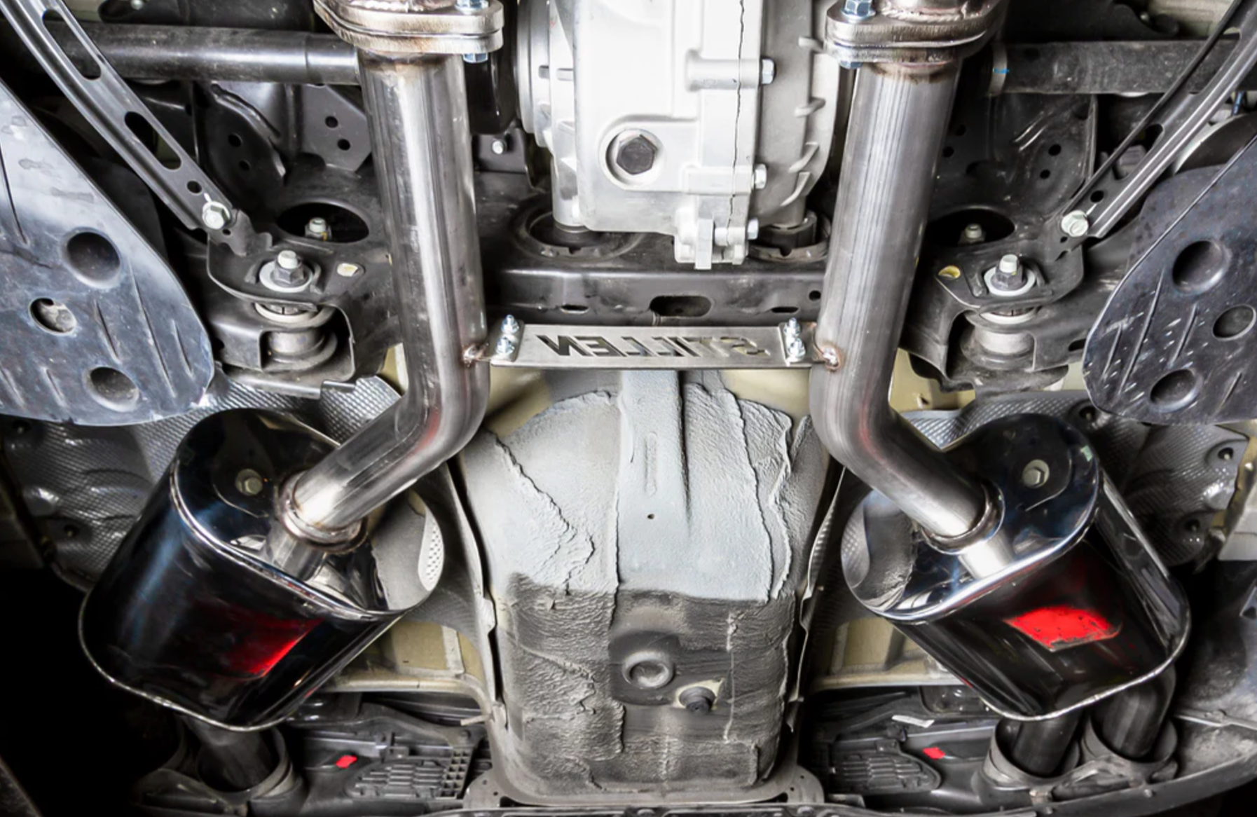 A view of the Stillen Cat-Back Exhaust System for Kia Stinger GT [3.3L Twin Turbo] 2018-2023 fitted inside of a car