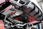 A close up view of Stillen Axle-Back Exhaust System for Nissan Maxima [3.5L] 2019-2023 fitted inside of a lifted car 