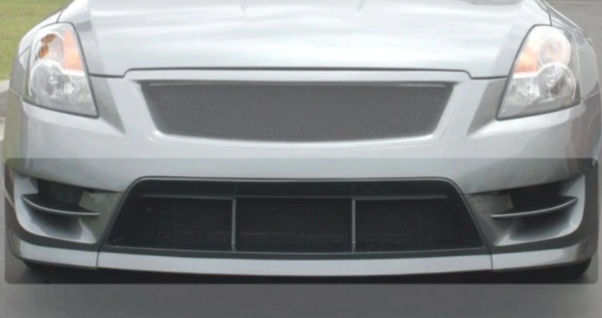 A front close up view of Stillen Mesh Grille Insert [STILLEN Fascia] for Nissan Altima 2007-2012 fitted on a grey car