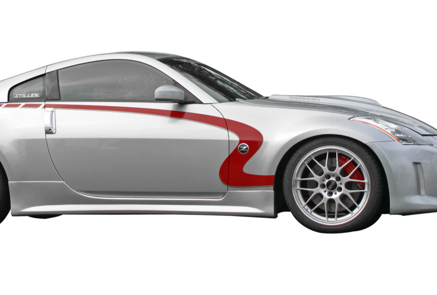 A side close up view of a grey car fitted with Stillen 4-Piece Body Kit [Series 2 Skirts w/ Series 2 Front Fascia] for Nissan 350Z [Z33] 2003-2008 on a white background