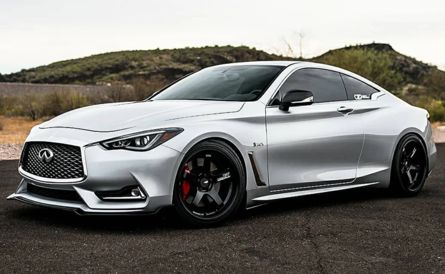 A wide view of the side of a car fitted with Stillen Front Splitter for Infiniti Q60 3.0t 2017-2022