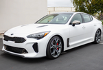 A side wide view of a white car on the ground fitted with Stillen Front Splitter [Matte Black] for Kia Stinger GT (AWD/RWD 3.3TT) 2018-2023