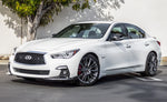 A side wide view of a white car fitted with Stillen Front Splitter [Matte Black] for Infiniti Q50 2018-2024 on the ground