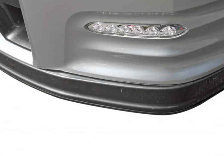 A close up view of Stillen Polyurethane Skid Plate for Nissan GT-R [R35] 2012-2015 on a white background