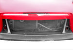 A front close up view of a red car fitted with Stillen Brake Cooling Duct Inserts [Fangs] for Nissan 370Z [Z34] 2009-2020 with white background