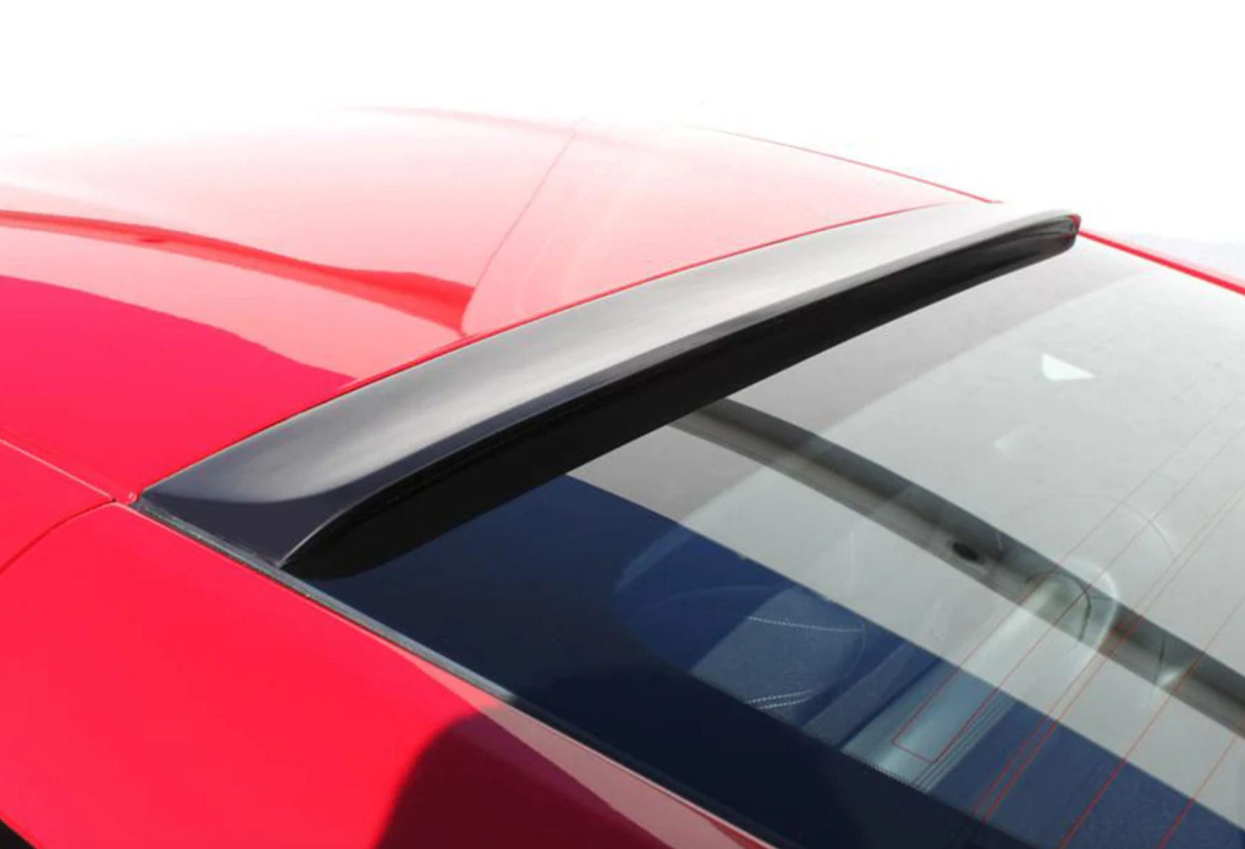 A back view of a red car fitted with Stillen Roof Wing for Nissan 370Z [Z34] 2009-2020 on a white background