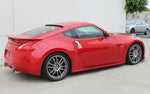 A wide side view of a red car fitted with Stillen Side Skirt Set for Nissan 370Z [Z34] 2009-2020 on the ground