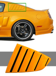 A side close up view of a yellow mustang fitted with Stillen Side Window Louvers for Ford Mustang 2010-2013 on a white background