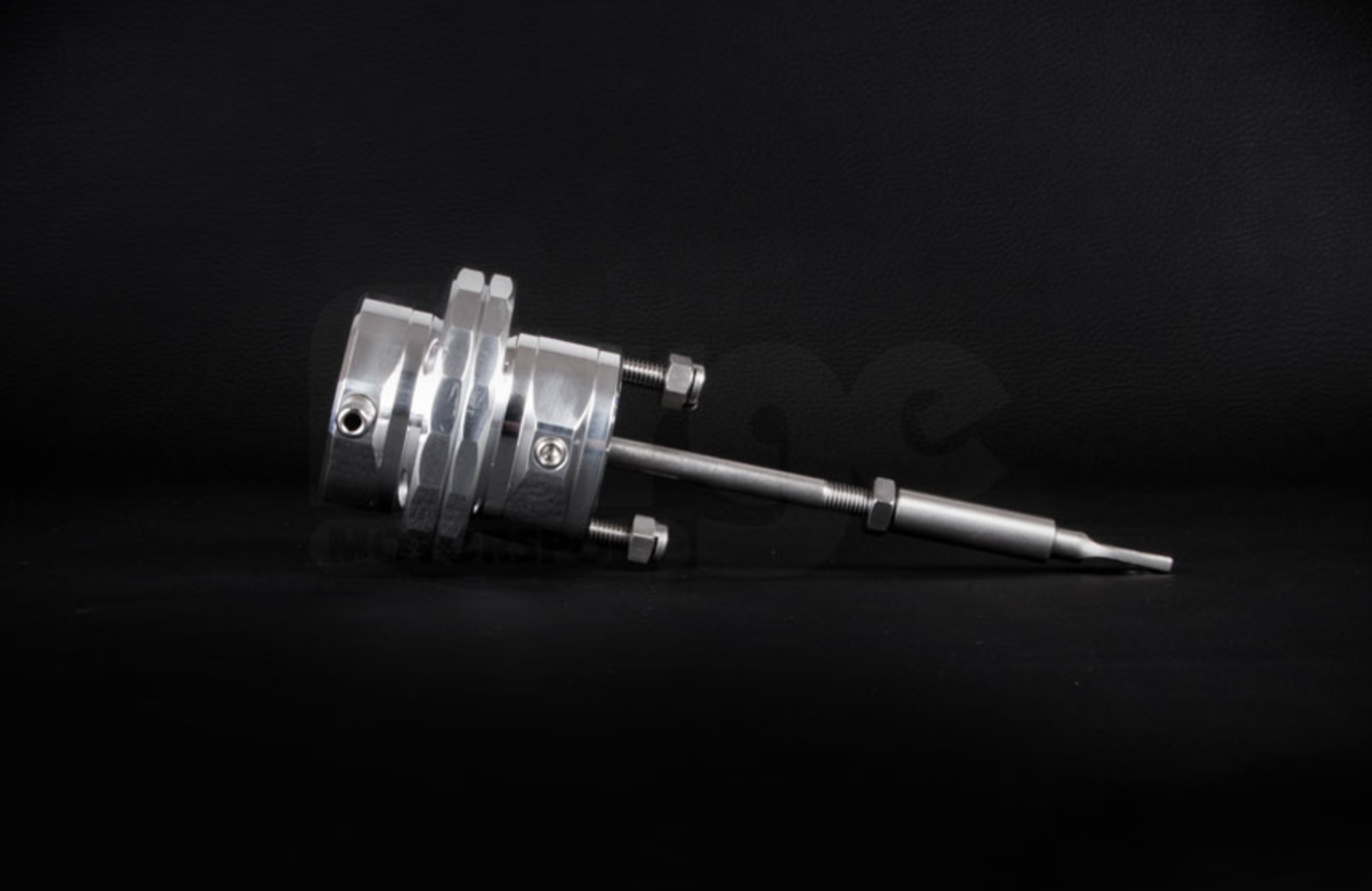 A side wide view of Forge Motorsport Turbo Actuator for Vauxhall Corsa 1.4T (D / E) 2010-2019 with black background