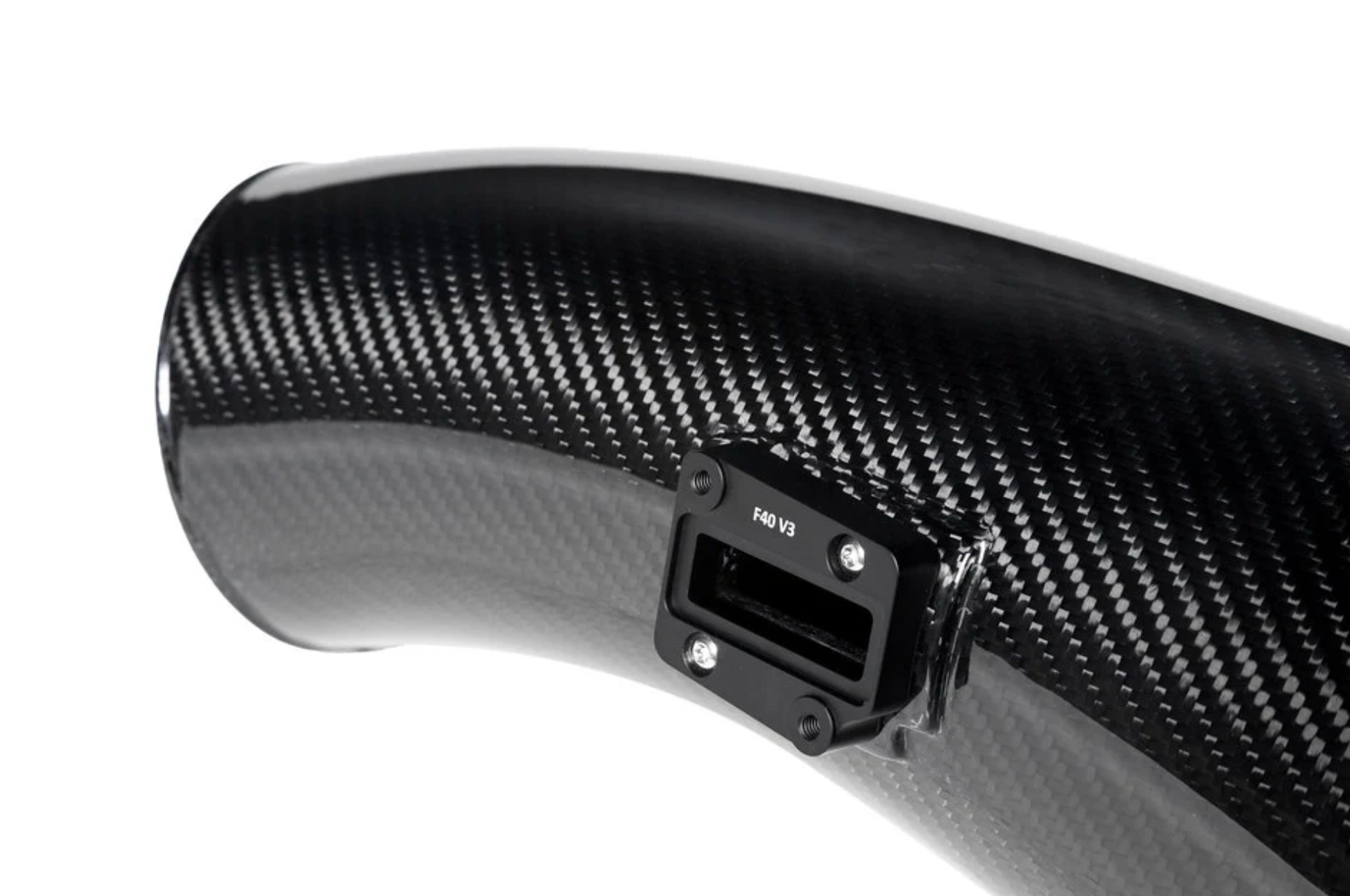 A close up view of one of the parts of Eventuri Black Carbon Intake System for BMW F7X M135i M235i / U1X X1 X2 M35i & MINI F6X S JCW 2020-2025 with white background