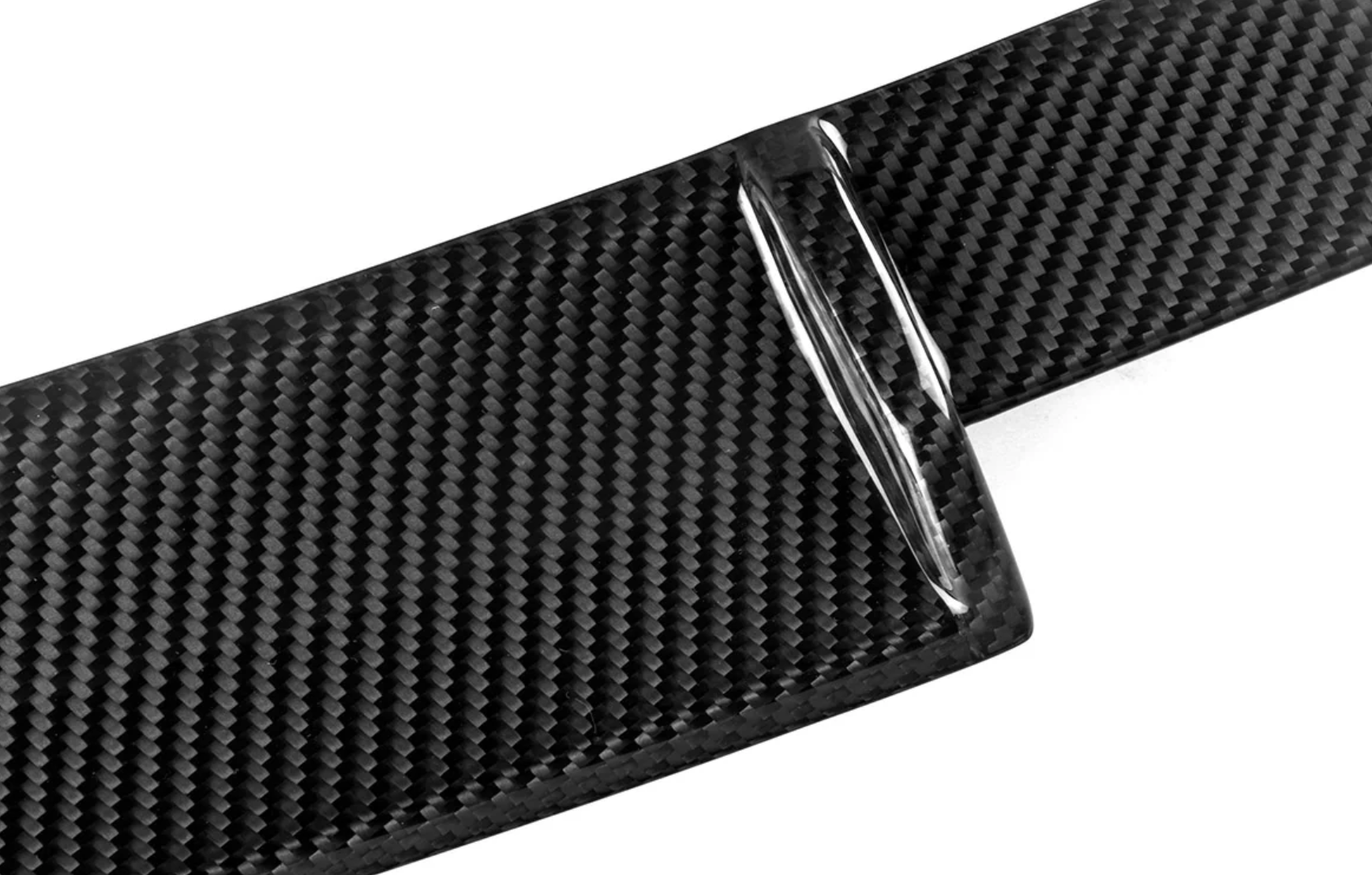 A close up view of AutoTecknic Carbon Fiber Hatch Spoiler - BMW F96 X6M / G06 X6 2019-2025 with white background