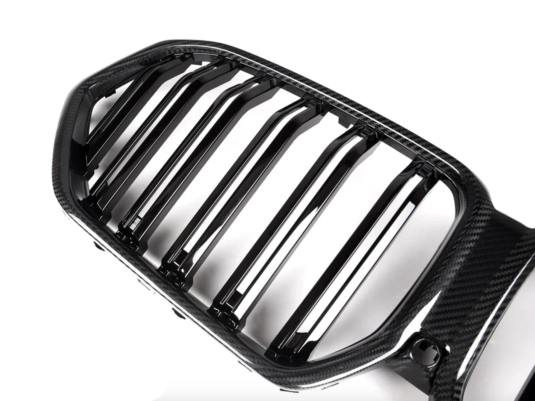 A close up view of AutoTecknic Dual-Slat Carbon Fiber Front Grille - BMW G06 X6 LCI 2023-2025 with white background