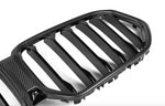 A front close up view of AutoTecknic Carbon Fiber Front Grille - BMW G06 X6 LCI 2023-2025 with white background