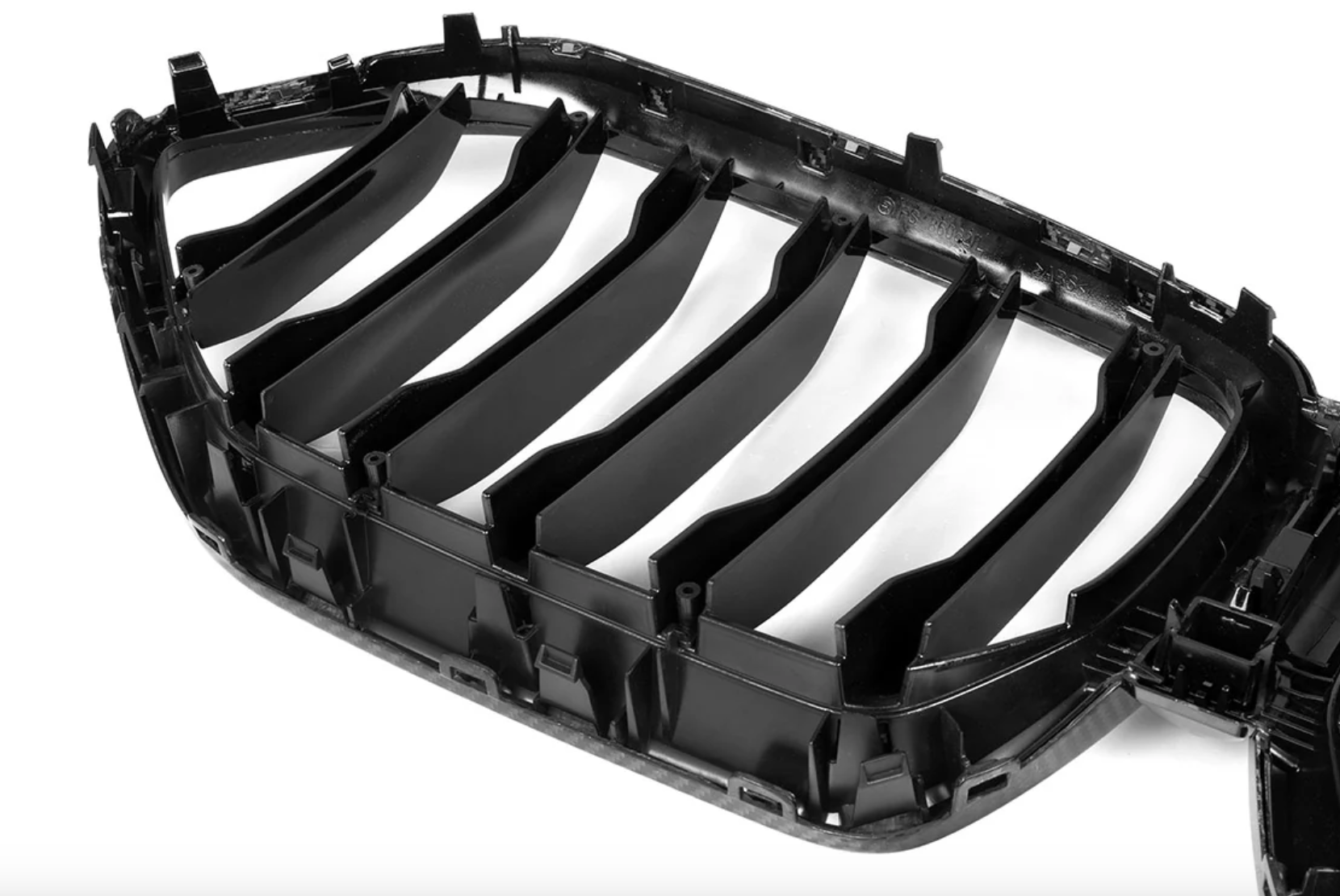 A back close up view of AutoTecknic Carbon Fiber Front Grille - BMW G06 X6 LCI 2023-2025 with white background