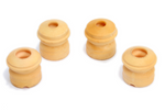 Four cream-colored, cylindrical foam bump stops of varying heights and shapes arranged on a white background. The two larger pieces have a smooth, tapered design, while the two shorter pieces feature a ribbed, multi-stage structure.