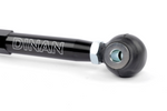 A detailed view of the opposite end of the toe link, featuring a U-shaped silver metal mounting bracket attached to the hexagonal rod with a silver locking nut.