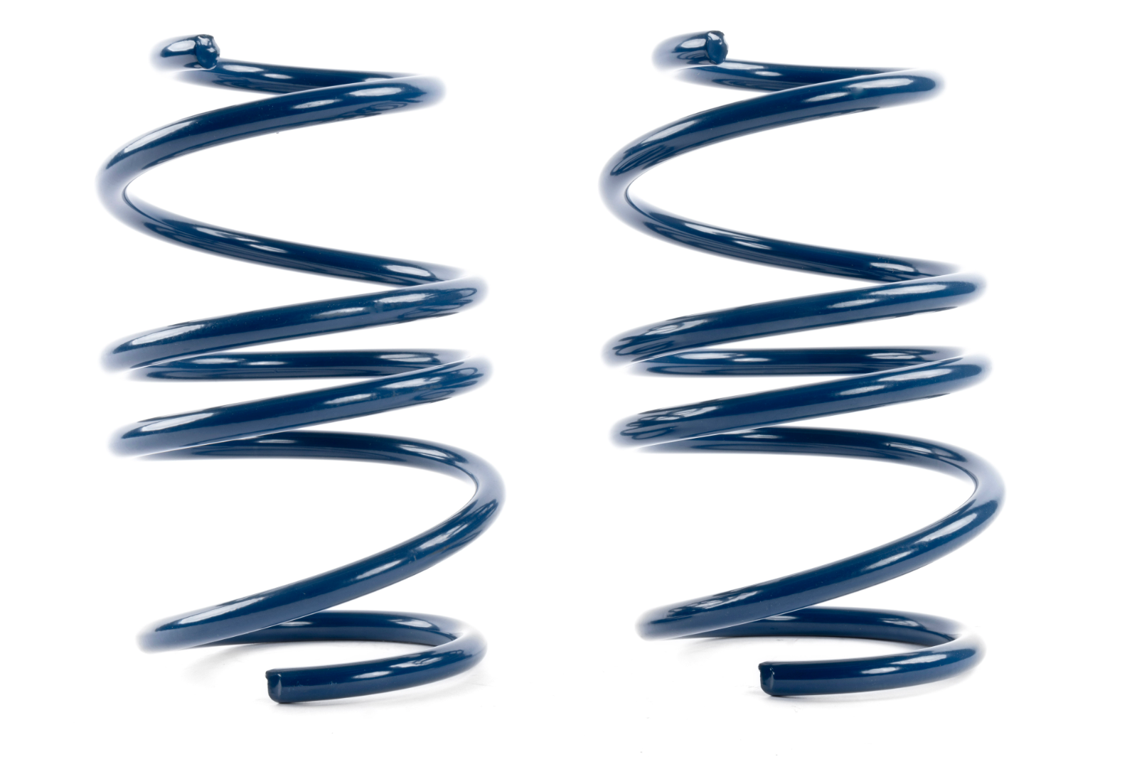 Two dark blue coil springs standing vertically side-by-side on a white surface.