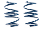 Two dark blue coil springs standing vertically side-by-side on a white surface.