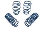 A set of four dark blue performance coil springs, with two standing vertically in the back and two lying horizontally in the front on a white background.