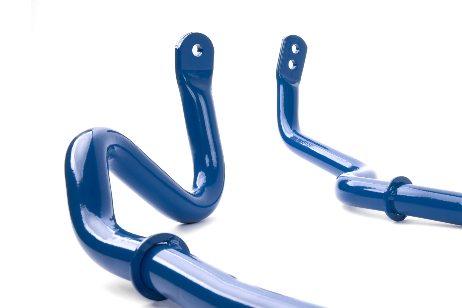 A close-up view of the curved ends of two blue anti-roll bars, showing the mounting points and pre-drilled holes.