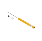 A single yellow automotive shock absorber with a long silver piston rod, shown alongside mounting hardware including a small black cap, a nut, a washer, and a small white plastic piece on a white background.