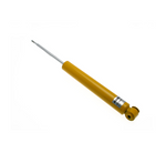A single yellow automotive shock absorber with a silver piston rod extended, featuring a mounting eyelet at one end and a threaded tip at the other, against a white background.