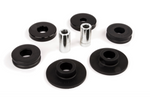 A collection of automotive hardware including two silver metal sleeves, four black flat circular bushings, and two black contoured circular bushings, all arranged on a white background.