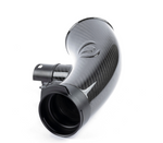 A side-profile view of the glossy carbon fiber turbo inlet pipe, highlighting its tapered shape and smooth finish against a white background.